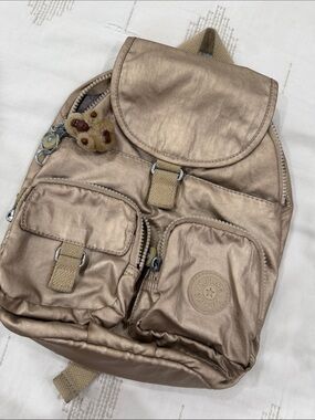 Kipling Metallic Gold Mini Backpack with Monkey Charm